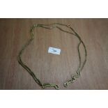 Yellow metal muff chain with gold clasps 35.1g total weight