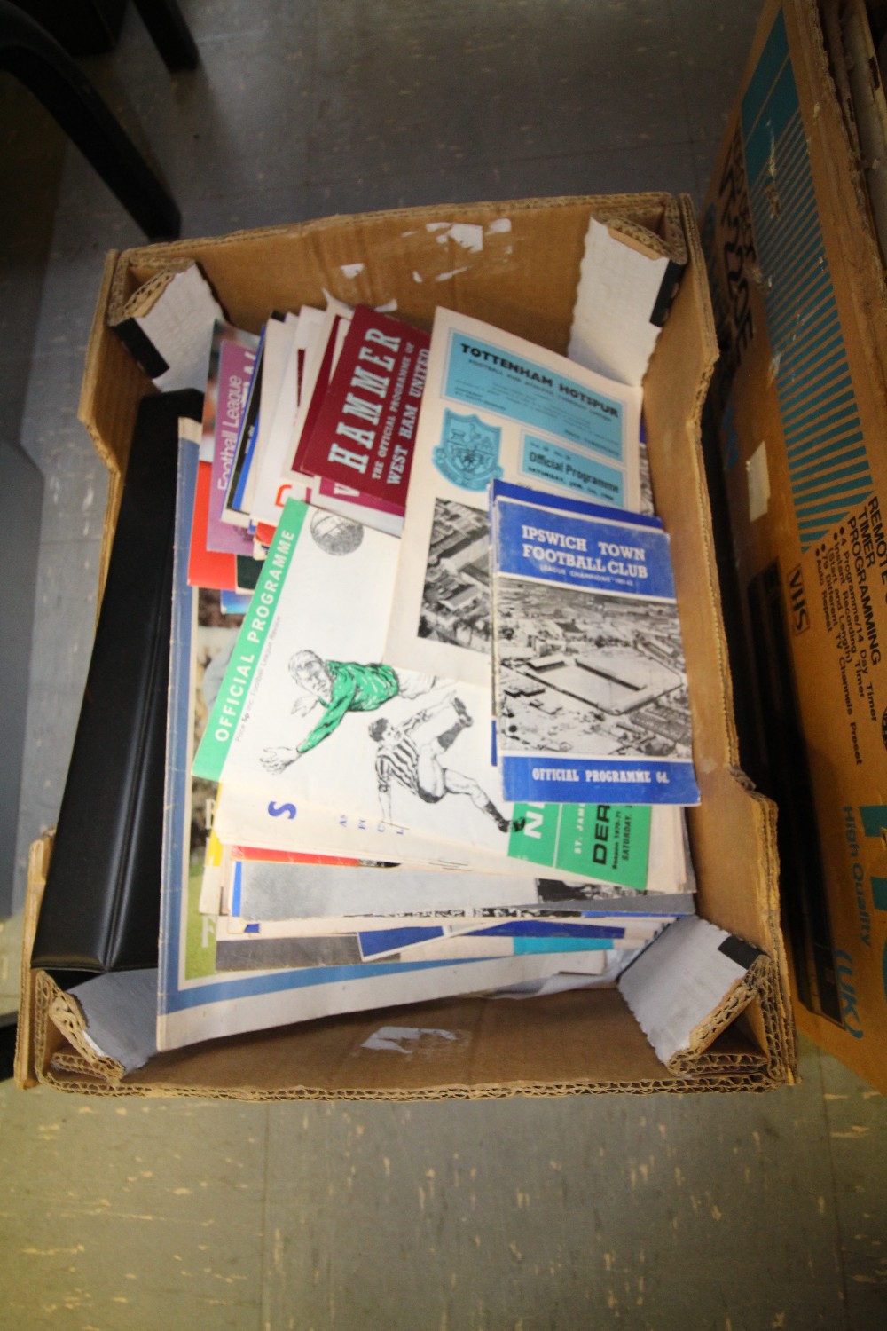 Box of football programmes