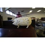 Plaster pig figure