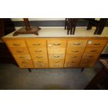 Double sided bank of light wood haberdashery drawers