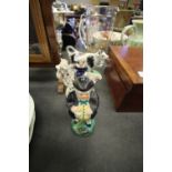Staffordshire pottery cow creamer and 2 figures