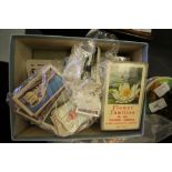 Box of cigarette cards, postcards, stereoscope cards
