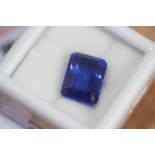 Heat treated emerald cut 8.02ct natural sapphire, with GGL certificate