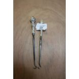 Two silver handled button hooks
