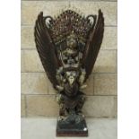 Carved and painted wooden figure of Garuda and Wisnu, 105cm high x 164cm wide x 32cm deep (slight