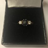 18ct gold mounted diamond and blue stone ring, size L
