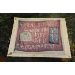 Colour poster, 'Women's Struggle Won the Vote', photograph of a banner carried on the WFLOE march