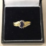 9ct gold mounted diamond and sapphire ring, central sapphire approx 0.3ct, ring size N/O
