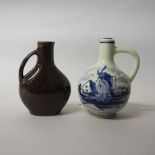 Two small Delft liquer jugs, blue and white and brown glazed, 8cm high and 7.5cm high