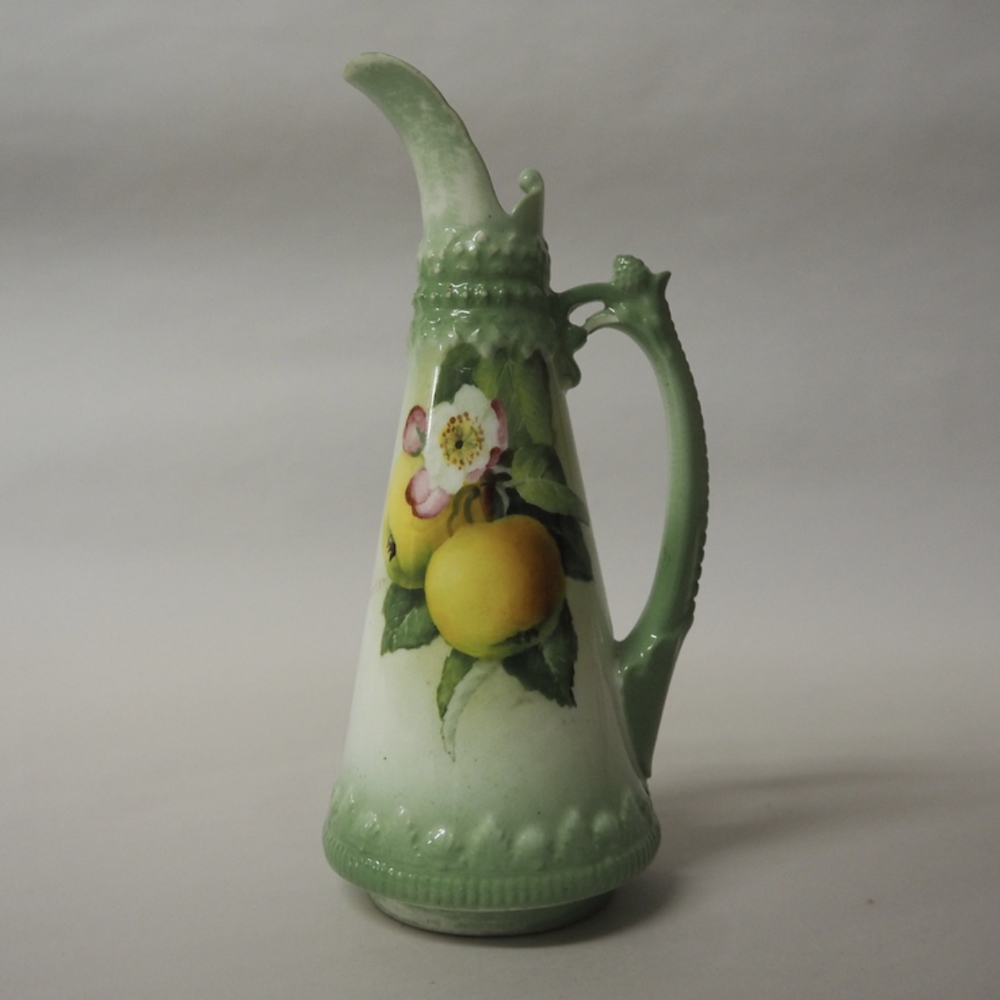 Royal Worcester porcelain green ewer, painted with fruit by F. Parker, green printed mark, date code
