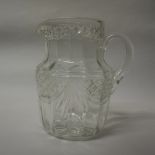 Early 20th Century moulded clear glass water jug, 20cm high