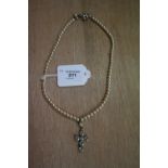 Paste Crucifix with Pearl Necklace