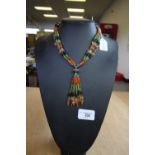 Indian silver and multi gemstone necklace on stand