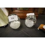 Pair of Paperweights with Decorative Splash and Swirl Design