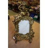 19th Century gilt cast metal photograph frame, with crowned female surmount, 35cm high