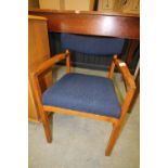 Teak armchair, yew wood finish oval table, tapestry seated chair