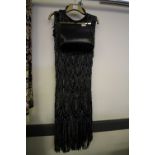 1920s flapper dress and black leather handbag