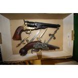 Box of replica pistols and knives