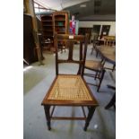 Three Edwardian chairs, all caned