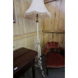 White painted wrought iron and brass telescopic standard lamp with shade