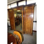 Victorian figured walnut and ebonised three door wardrobe