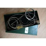 Silver bangles and necklaces