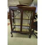 Mahogany display cabinet with ball and claw feet