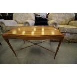 Yew wood finish coffee table of shaped outline
