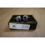 Pair of purple and white C2 white metal cufflinks and stud box