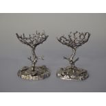 Pair of silver plated Coral and Seashell design salts, in the manner of Elkington, 16cm high