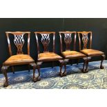 Set of four 1920's mahogany dining chairs of Hepplewhite design with hide seats, retailed by