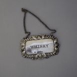 Elizabeth II silver 'Whisky' decanter label of Victorian design by DJS, London 1968 (dented)