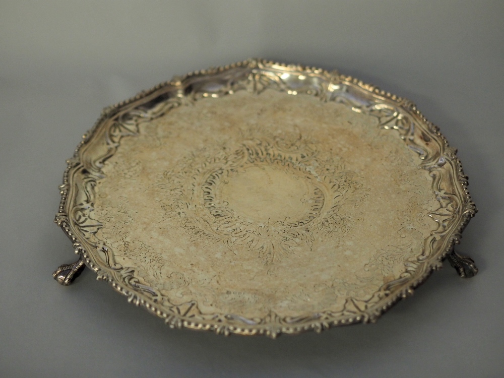 Victorian silver plated salver by MH & Co, with pie crust rim on three splayed claw and ball feet,