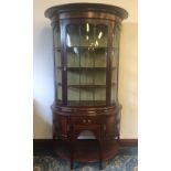 Edwardian inlaid mahogany bowfront display cabinet of Art Nouveau design, the base fitted single