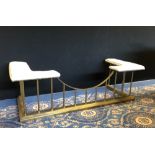 Lacquered brass Club fender, with cream upholstery, 160cm wide x 64cm deep x 51cm high, worn