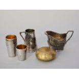 Brass portable ashtray, set six German white metal shot cups, plated cream jug and plated