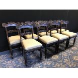 Set of nine Regency rosewood dining chairs, with shaped and moulded crest rails, drop in seats
