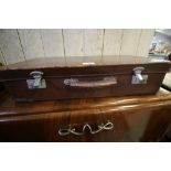 Brown leather suitcase stamped WL