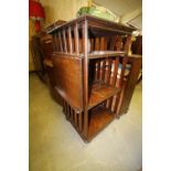 Victorian oak revolving bookcase with reading slide