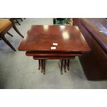 Nest three figured mahogany tables