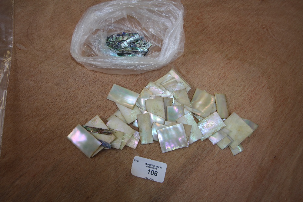 Quantity of mother of pearl and abalone shell veneers