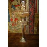 Oil lamp with marked silver plate stem, with glass font and gold colour shade