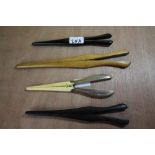 Pair of silver handled and ivorine glove stretchers and 3 other pairs of glove stretchers