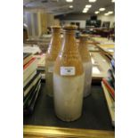 3 Penrith stoneware bottles - John Cockbaine T Lumb & Co