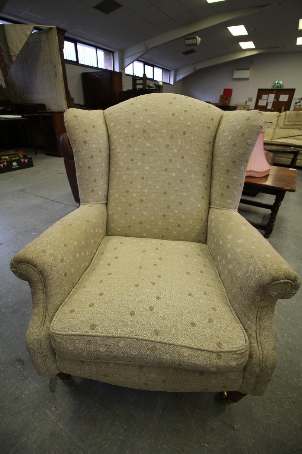 Winged Armchair with polka dot patterned upholstery