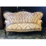 Victorian rosewood three seat 'Butterfly' shape settee, upholstered in buttoned rose and gold