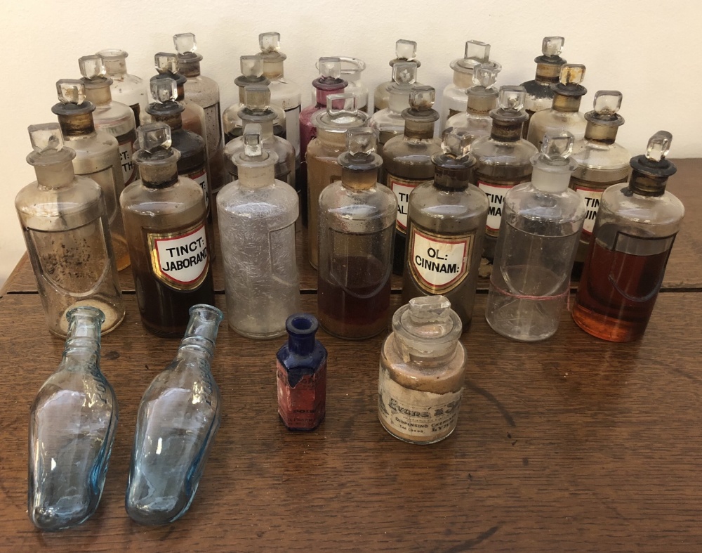 Three Victorian blue glass Poison bottles and 29 early 20th Century clear glass Medicine bottles,