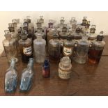 Three Victorian blue glass Poison bottles and 29 early 20th Century clear glass Medicine bottles,