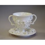 19th Century Derby 'Blanc de Chine' floral encrusted porcelain cup and saucer, blue underglaze
