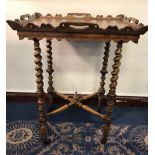 Early 19th Century rosewood occasional table, the shaped gallery with handle cut outs on spiral